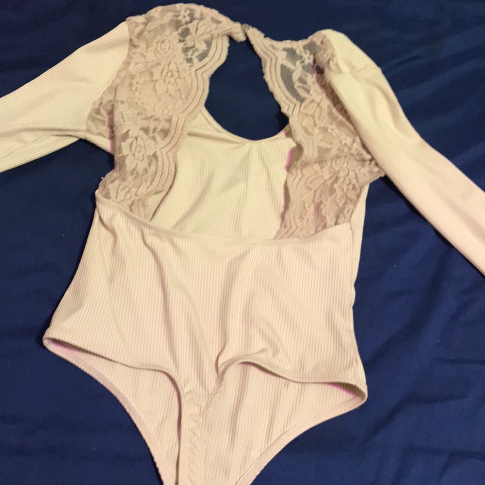 Open back tan body suit
